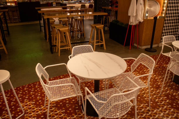istock a group of white chairs sitting on top of a table 1925390489