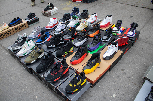 Nyc, United States – January 07, 2024: An array of assorted footwear is displayed in their original boxes, creating an eye-catching merchandising display