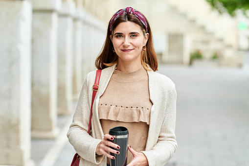 Woman with reusable cup on the street