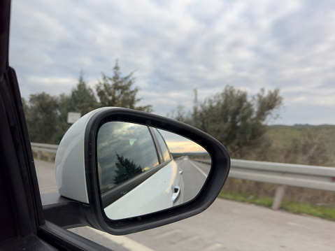 Perspective view of cracked car windscreen or windshield from inside vehicle while driving