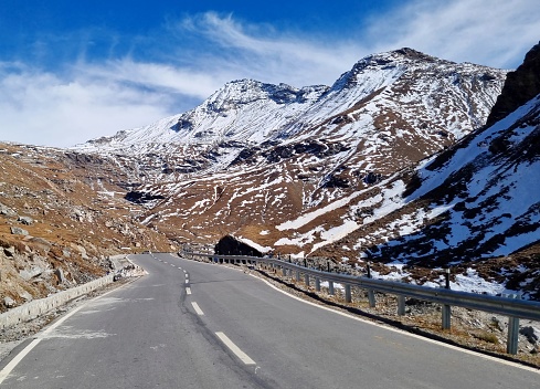 Curved mountain roads passing through the snowy mountains