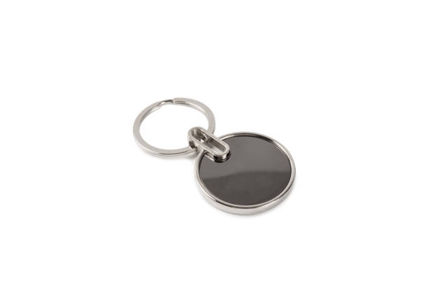 istock Keychain with key ring isolated on white background. Concepts for real estate and moving home or renting property. Buying a property. Mock-up keychain.Copy space. 1925480488