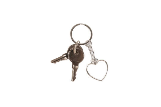 istock Keychain with key ring isolated on white background. Concepts for real estate and moving home or renting property. Buying a property. Mock-up keychain.Copy space. 1925480494