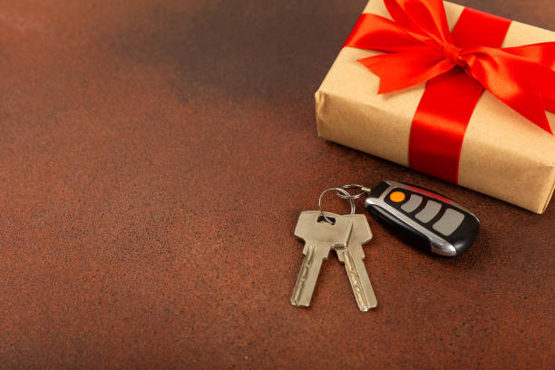 istock Keychain with key ring isolated on a colored background. Concepts for real estate and moving home or renting property. Buying a property. Mock-up keychain.Copy space. 1925481561