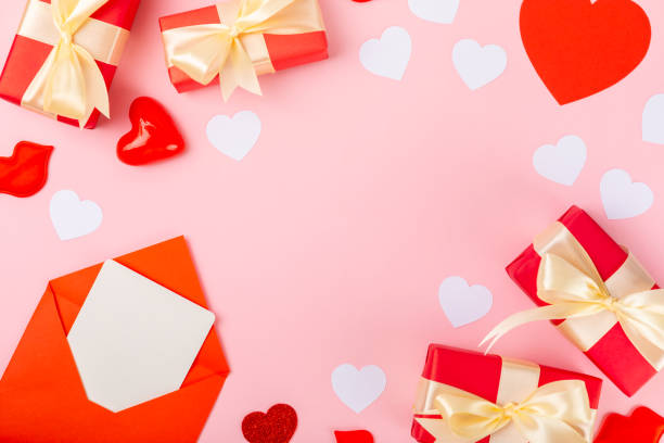 istock Valentine's Day concept. Valentine's Day background. Gifts, candles, confetti, envelope - postcard on background. Flatley, top view, copy space.Valentine's day celebration 1925483130