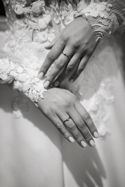 Close-up of bride's hands with a wedding ring
