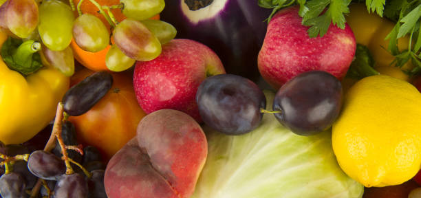 istock Beautiful background from various vegetables and fruits. Wide photo. 1925487842