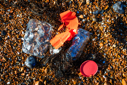 A pile of plastic products washed up on the beach.