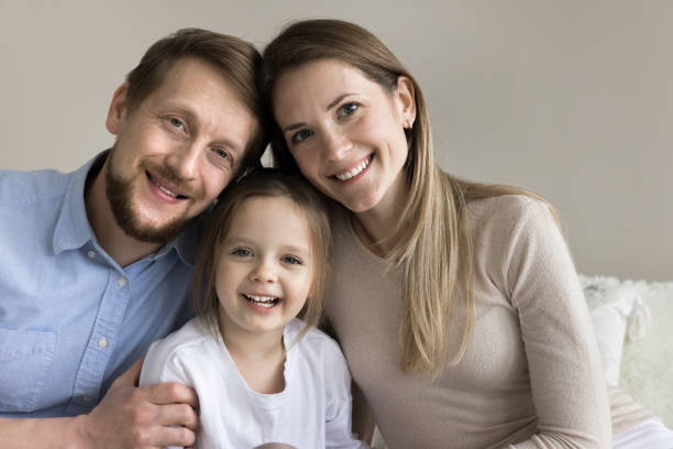 istock Happy beautiful mom and handsome dad sitting close 1925511496