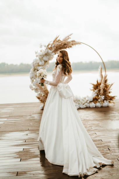 istock bride against the background of a yellow sunset 1925517732