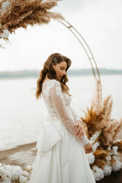 istock bride against the background of a yellow sunset 1925520423