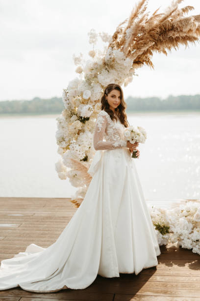 istock bride against the background of a yellow sunset 1925520940