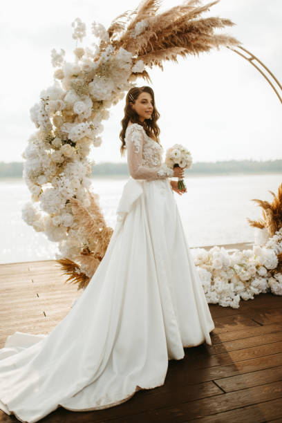 istock bride against the background of a yellow sunset 1925521466