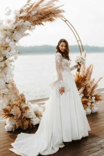 istock bride against the background of a yellow sunset 1925523034