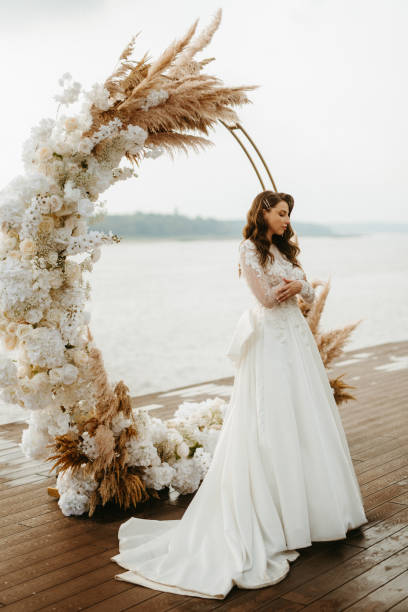 istock bride against the background of a yellow sunset 1925530037