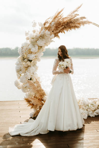 istock bride against the background of a yellow sunset 1925530570