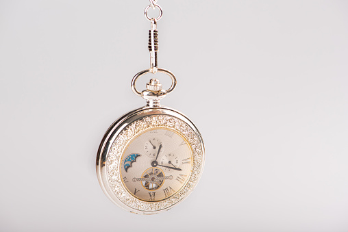 Classic gold pocket watch.