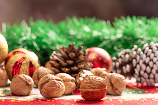 Christmas table, a beautiful table with nuts and christmas accessories, selective focus.