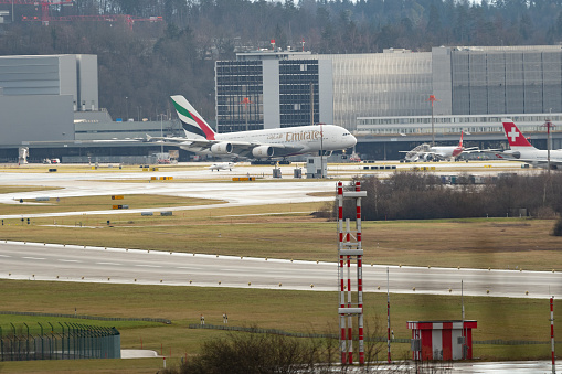 Zurich, Switzerland, January 4, 2024 A6-EEK Emirates Airbus A380-861 is landing on runway 28