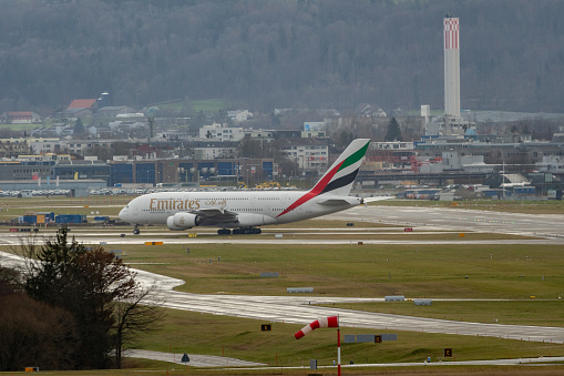 Zurich, Switzerland, January 4, 2024 A6-EEK Emirates Airbus A380-861 aircraft is taxiing to the gate