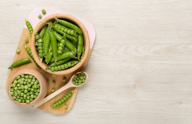 istock Composition with fresh green peas on wooden background, top view 1925546933