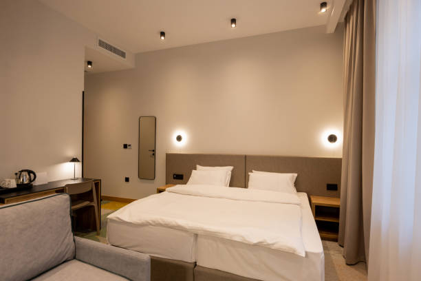 istock Interior of a hotel bedroom in the evening 1925571901
