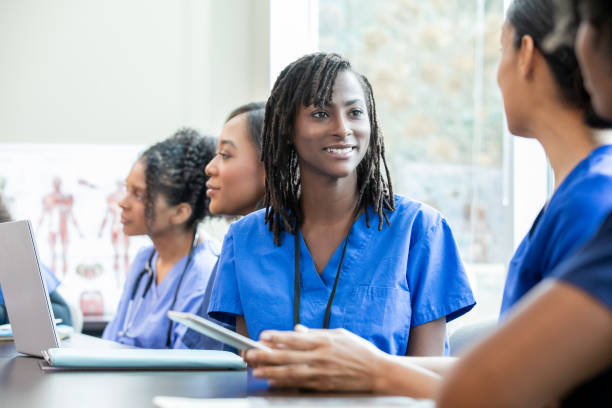 istock Nurse discusses healthcare class assignment during medical training class 1925592450