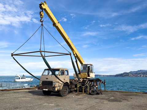 Crane in the port at the shipyard for the repair of boats