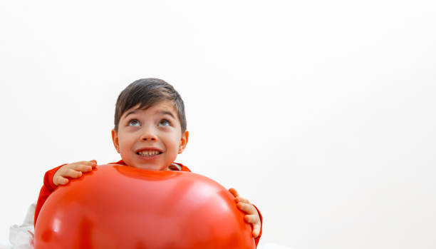 happy kid with big heart shape balloon