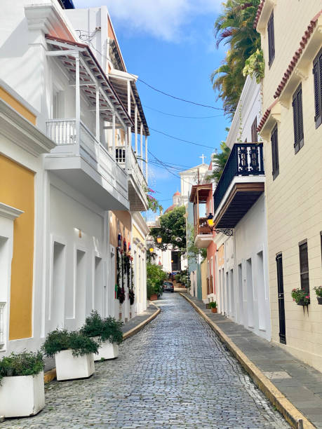 istock a cobblestone street that leads up to several buildings 1925615865