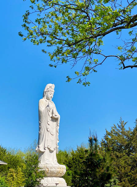 istock the statue is standing next to some trees in the park 1925615895