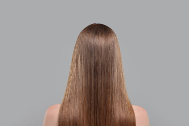 istock Woman with healthy hair on light grey background, back view 1925617035