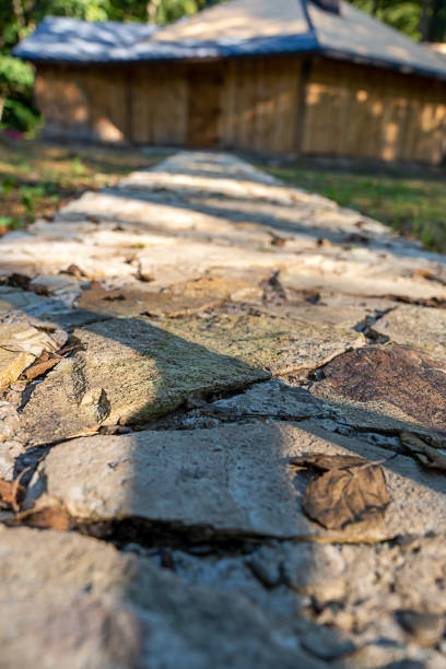 stone path to wooden house