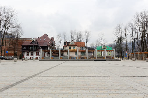 Zakopane, Poland - March 07, 2016: View across Independence Square towards famous and historic buildings, the entire revitalisation of the square was completed in 2013.