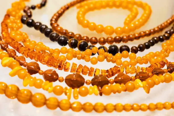 Photo of Round smooth beads made of natural honey Baltic amber.