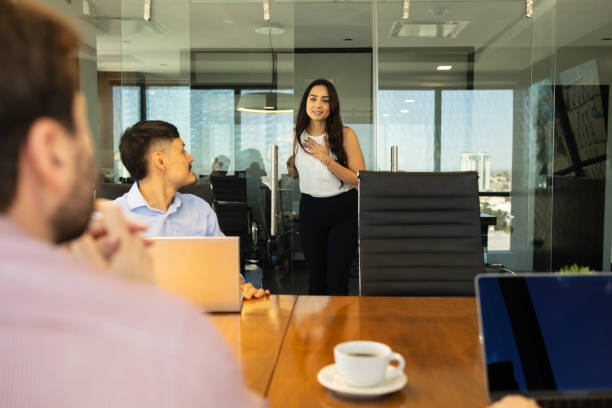 istock Latin woman asking permission to come into a meeting room at work 1925649876