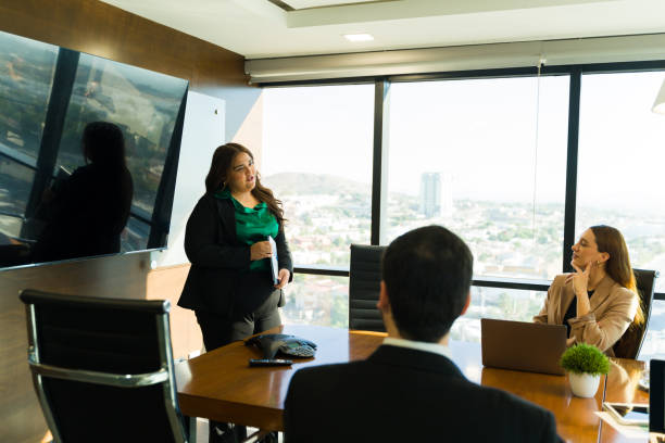 istock Plus size businesswoman giving a presentation to some important clients 1925656707