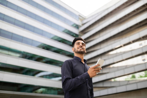 istock Arab Young Business Man Using Application On Smartphone Standing Outdoor 1925671489