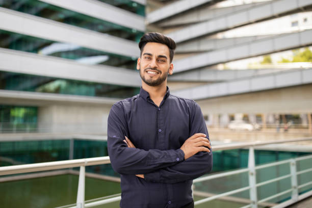 istock Happy middle eastern young businessman posing crossing hands outdoor 1925671512