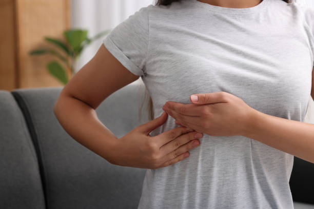 istock Woman doing breast self-examination at home, closeup 1925748901