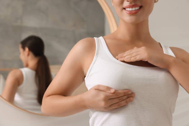 istock Woman doing breast self-examination in bathroom, closeup 1925751536