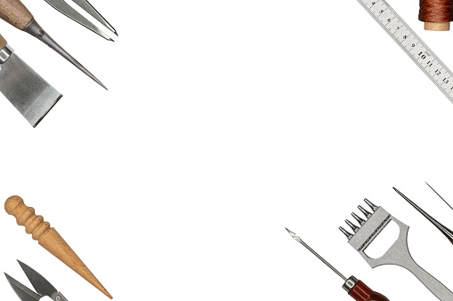 Set of cobbler tools on white background. Space for text.
