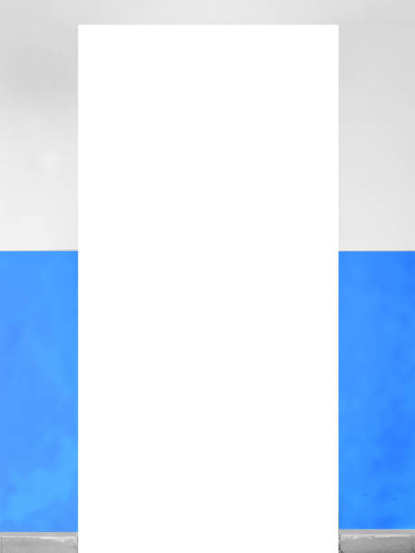 An empty cutout for a door in a white wall, the lower half of which is painted blue. Free space for a door on the wall.