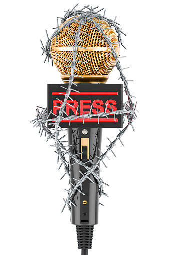 Microphone with barbed wire. Freedom of the press prohibition concept. 3D rendering isolated on white background