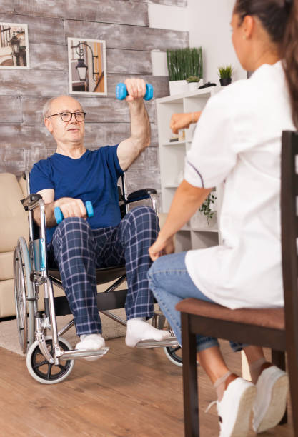 istock Grandfather in wheelchair doing sport 1925855983