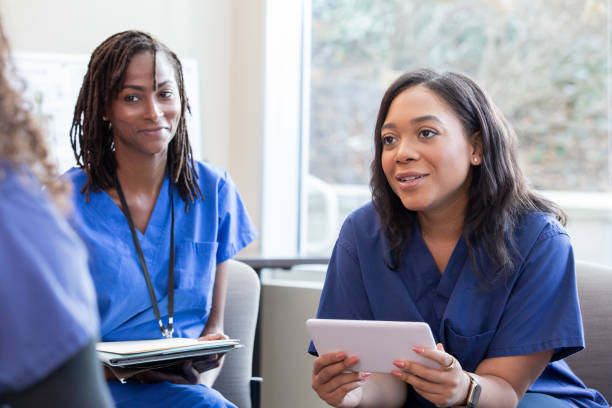 istock Nurses and doctors meet to discuss patient care plan in hospital 1925871066