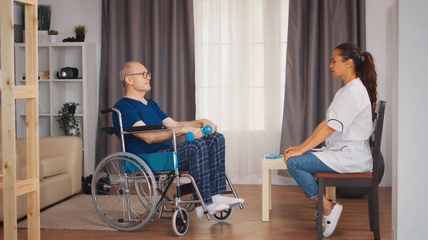istock Medical worker with old patient 1925875784
