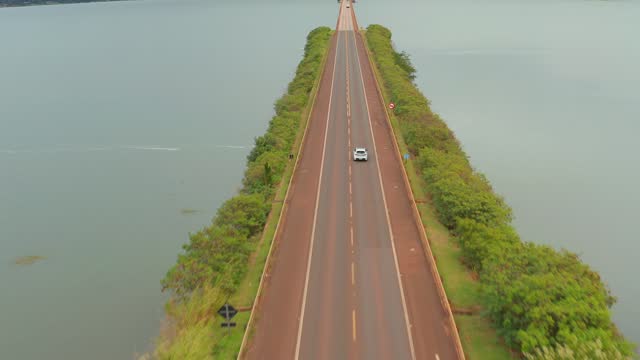 Aerial View of highway along a body of water