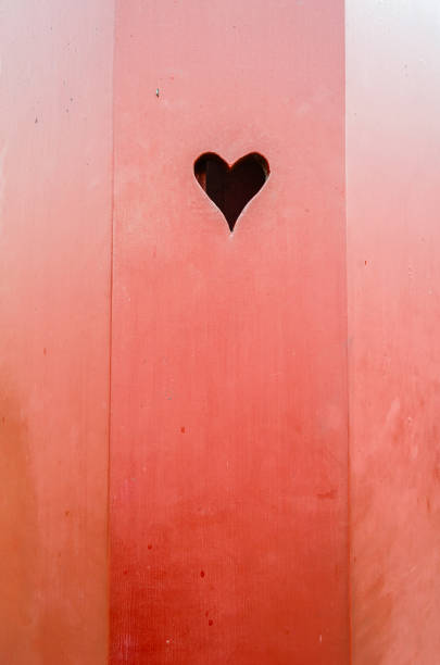 istock Heart shape on a red wooden door 1925933076