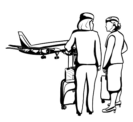 A couple of air stewardess are talking on the runway, holding on to their suitcase, just waiting to board the airplane behind them